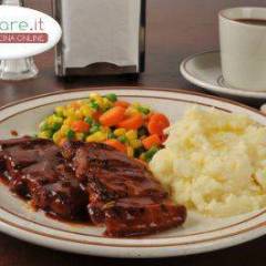 Costine con piselli e patate