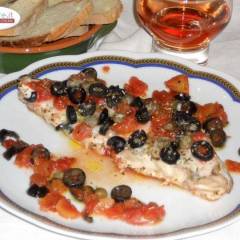 Ricciola al forno con capperi e olive nere